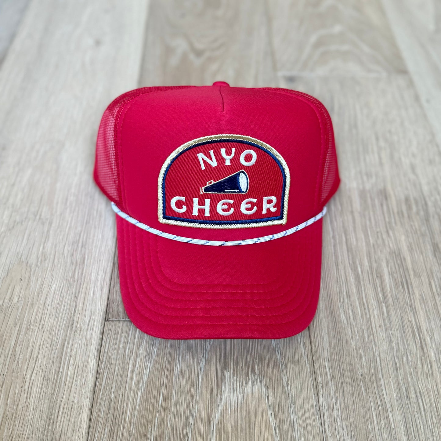 “NYO CHEER” trucker