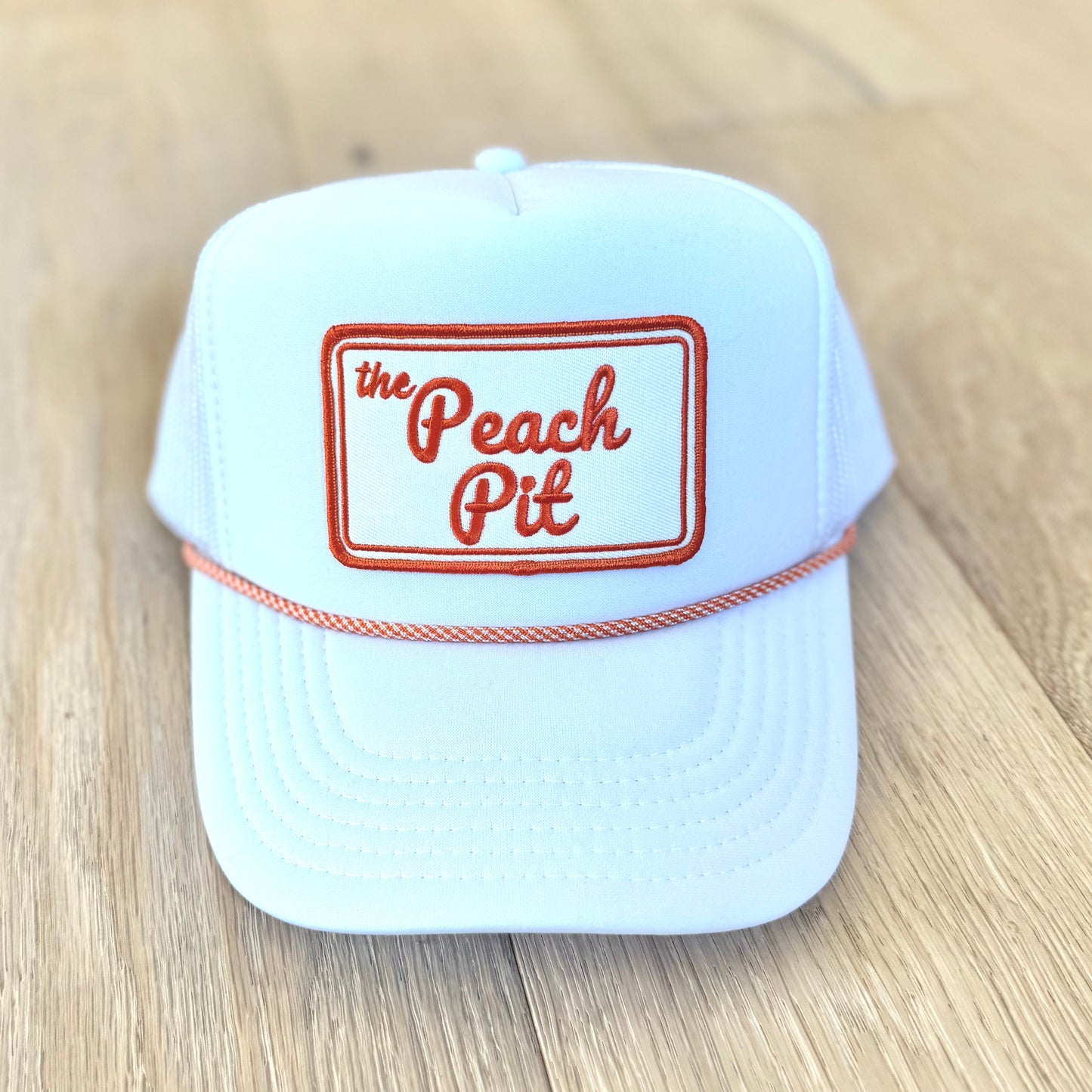 Peach Pit Trucker Hat