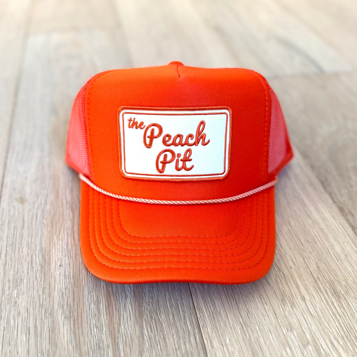 Peach Pit Trucker Hat