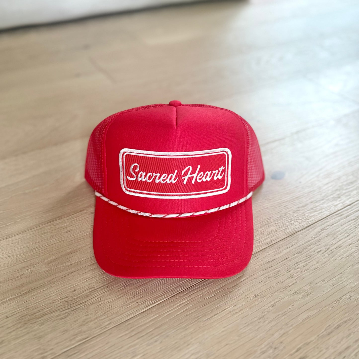“Sacred Heart” varsity trucker