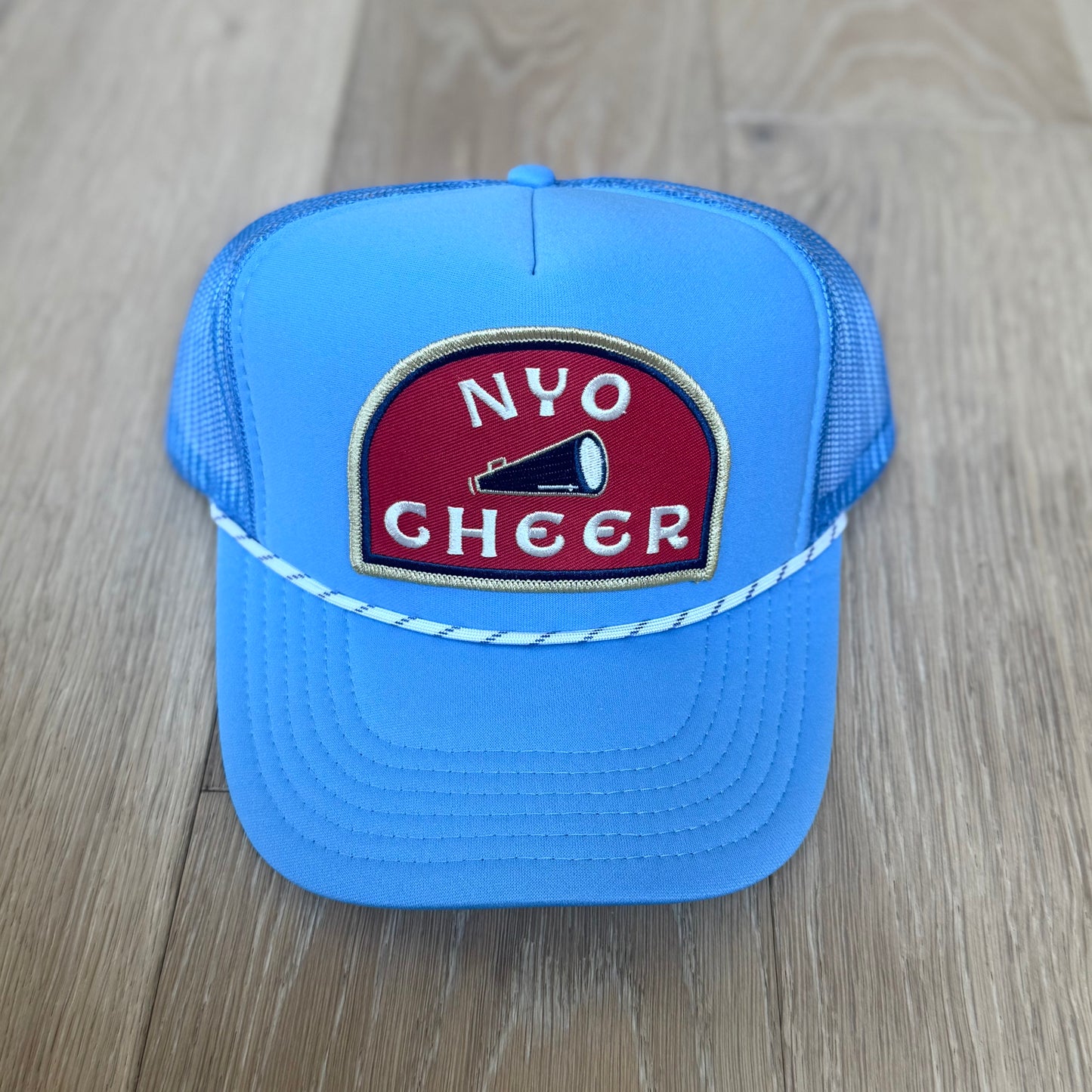 “NYO CHEER” trucker